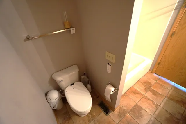 a bathroom with a toilet and sink