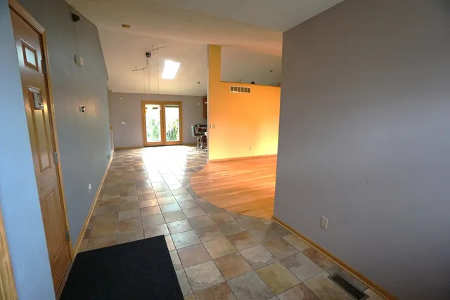 a view of hallway with furniture