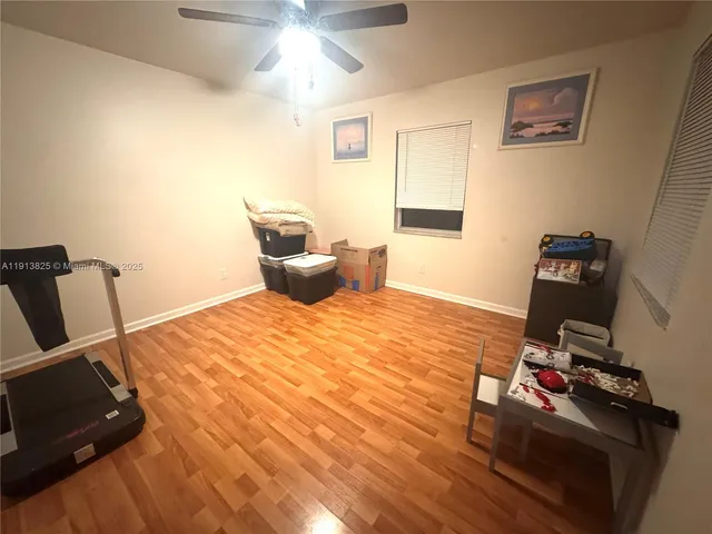 a bedroom with bed and a window