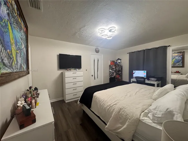 a bedroom with a bed and furniture