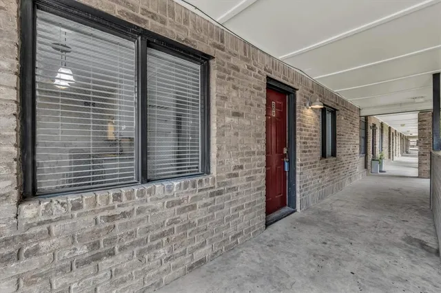 a kitchen with kitchen island a sink appliances and cabinets