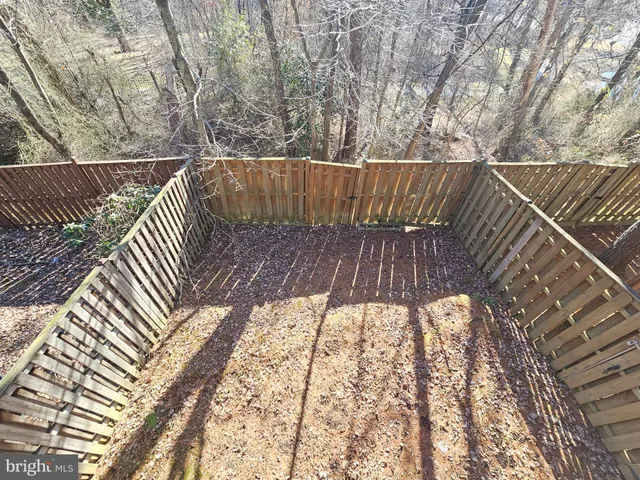 a view of balcony with wooden floor