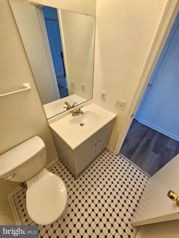 a bathroom with a toilet and a sink