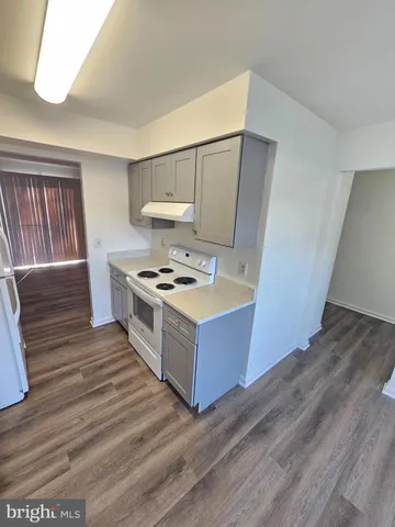 a kitchen with stainless steel appliances a refrigerator and a stove top oven