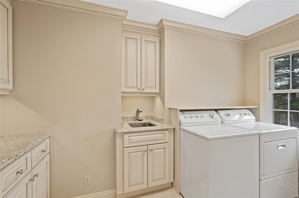 2676 Sunset Lane Allison Park, PA 15101 - Photo 12 of 25 The first floor laundry is off the kitchen and includes additional storage, updated cabinetry and a large pantry!