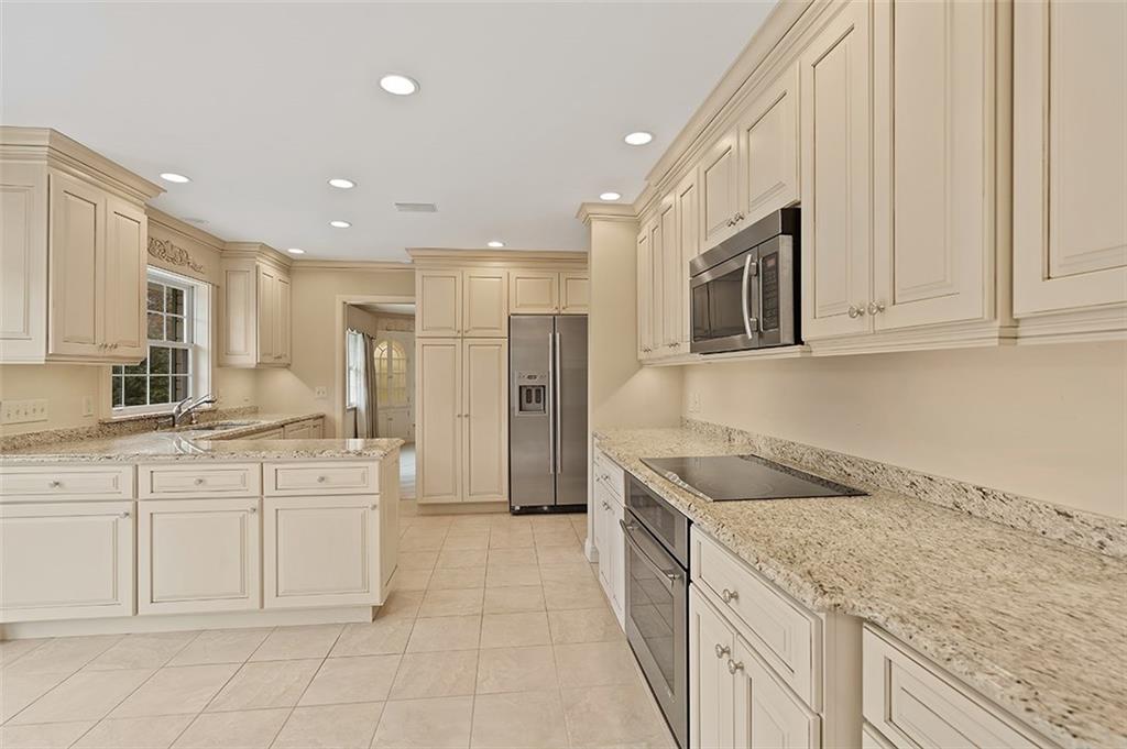2676 Sunset Lane Allison Park, PA 15101 - Photo 9 of 25 The Kitchen is the heart of the home! This chef's kitchen will not disappoint. Buttercream cabinets with a Sienna Glaze and soft close drawers. High end JennAir Stainless Steel Appliances, Granite Counters, Neutral Tile Flooring, Under cabinet lighting and Recessed lighting.