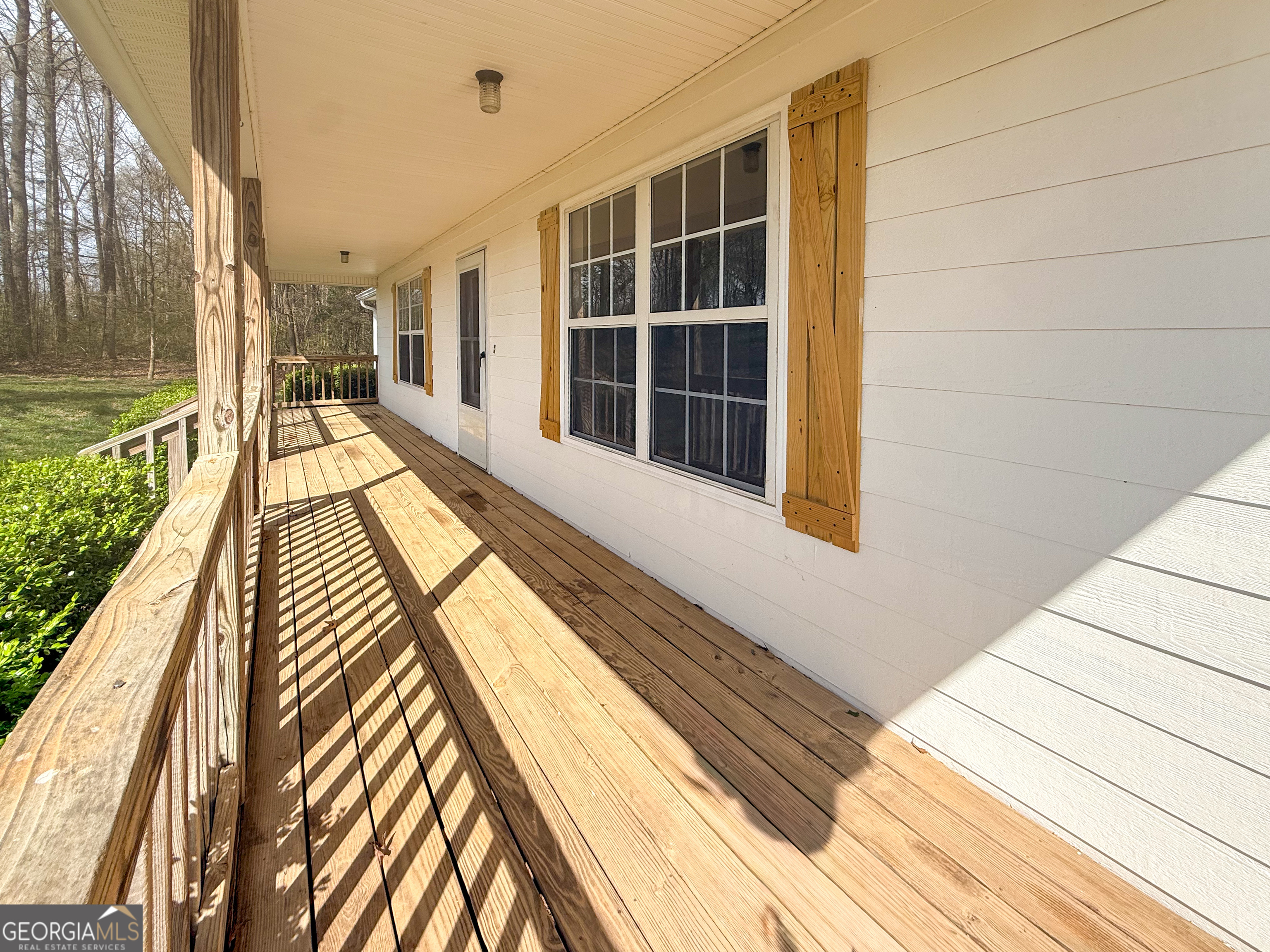 1492 Highway 198 Carnesville, GA 30521 - Photo 2 of 25 a view of a balcony with wooden floor