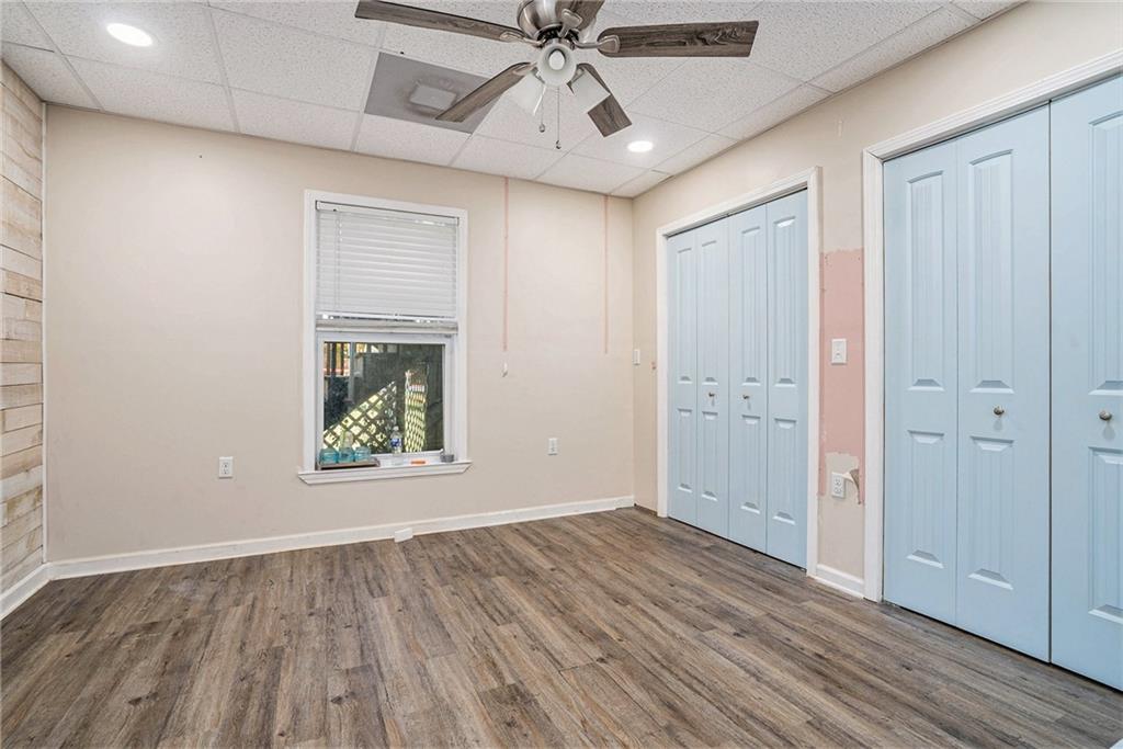115 Floating Leaf Way Dallas, GA 30132 - Photo 33 of 47 wooden floor in an empty room with a window
