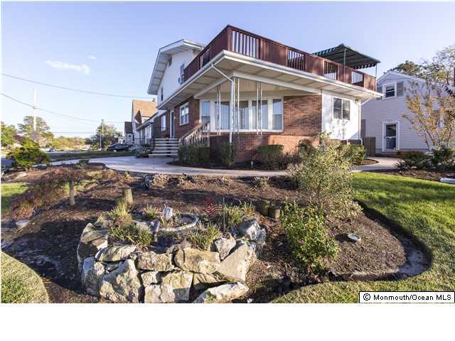 41 Albany Road Neptune Township, NJ 07753 - Photo 1 of 23 a front view of a house with a yard
