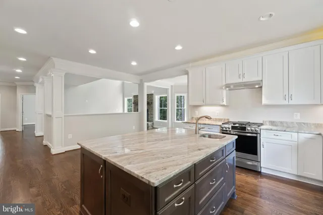 a view of a kitchen with a sink and cabinets