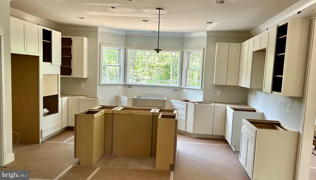 a kitchen with refrigerator and window