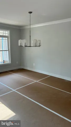 a view of empty room with windows