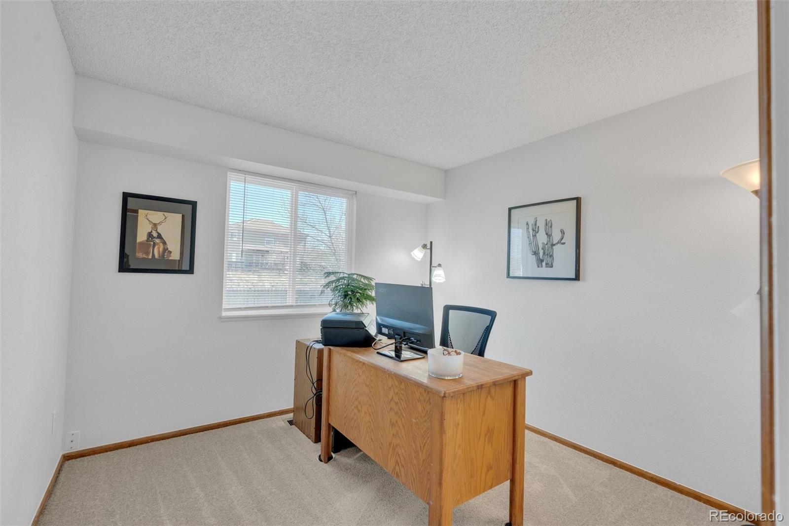 4320 Genoa Street Denver, CO 80249 - Photo 26 of 48 a workspace with furniture and window