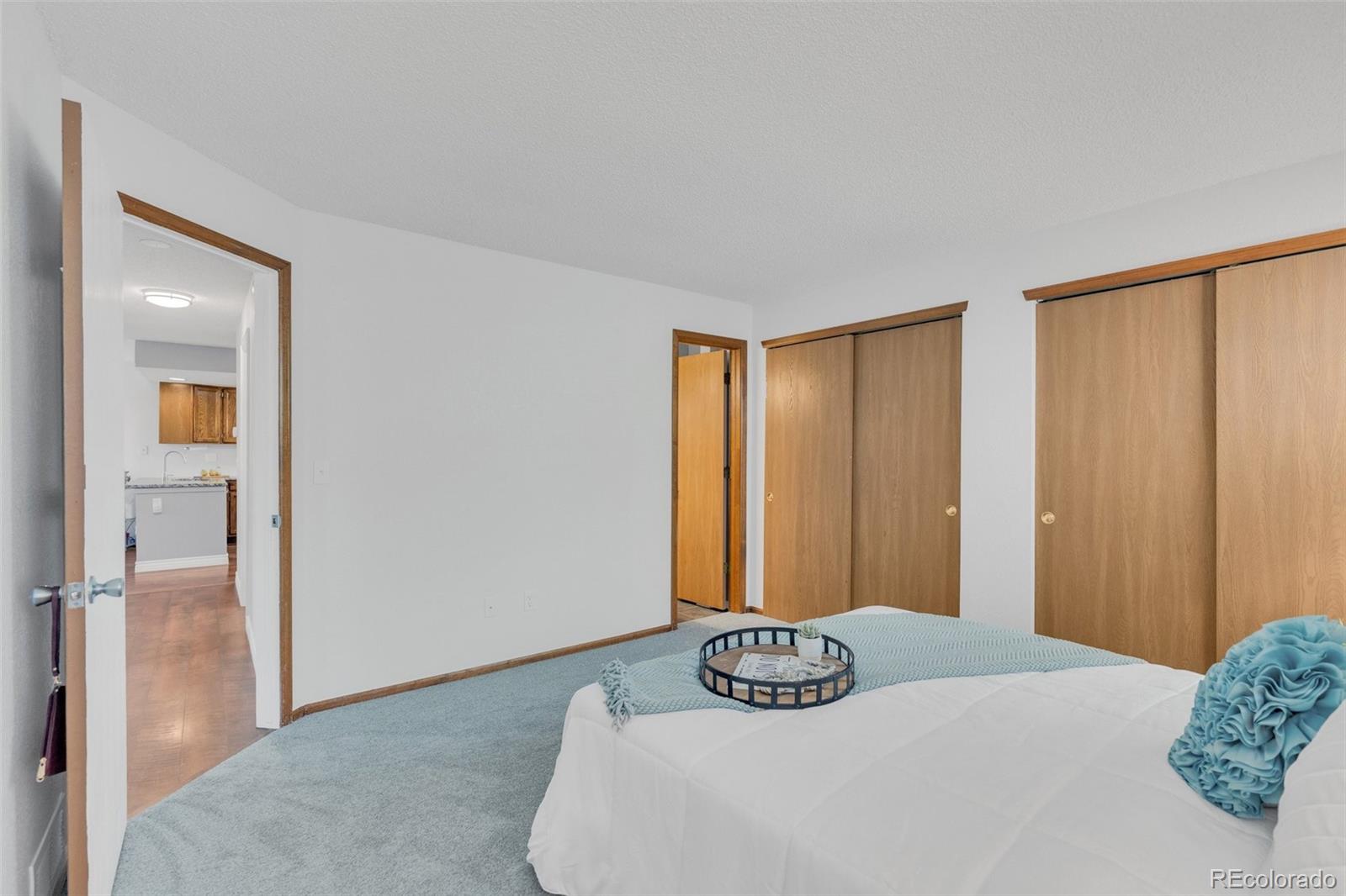 4320 Genoa Street Denver, CO 80249 - Photo 27 of 48 a bedroom with a bed and a window