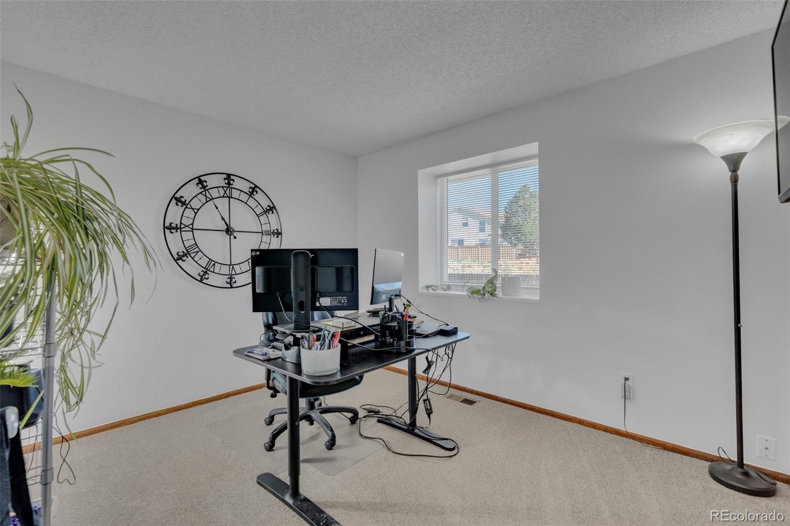 4320 Genoa Street Denver, CO 80249 - Photo 37 of 48 a view of a workspace with furniture