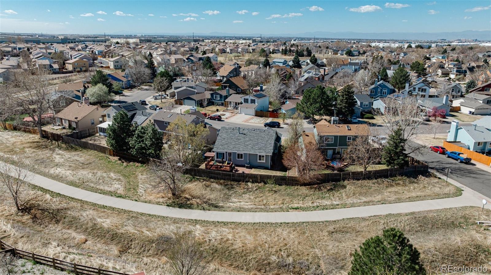 4320 Genoa Street Denver, CO 80249 - Photo 39 of 48 a view of a house with a yard