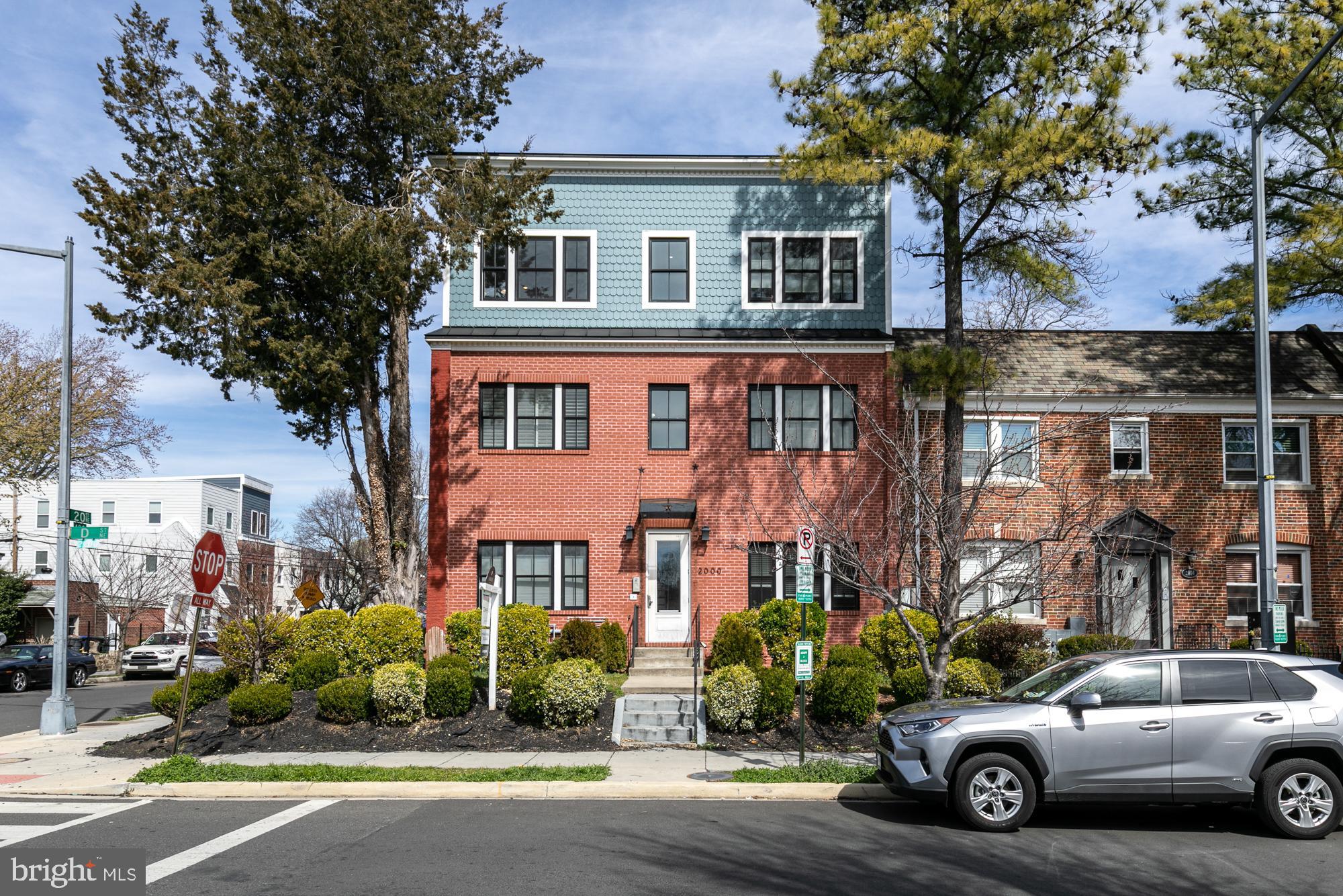 2000 D Street Northeast, Unit 5 Washington, DC 20002 - Photo 1 of 22 Boutique condo building flanked by tall evergreens