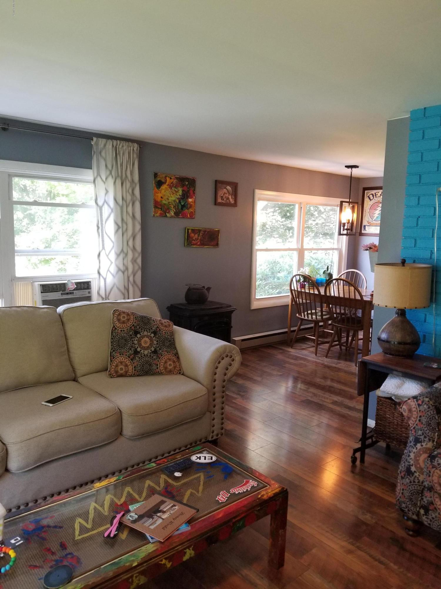 144 Mid Valley Road Lake Ariel, PA 18436 - Photo 23 of 55 a living room with furniture and wooden floor