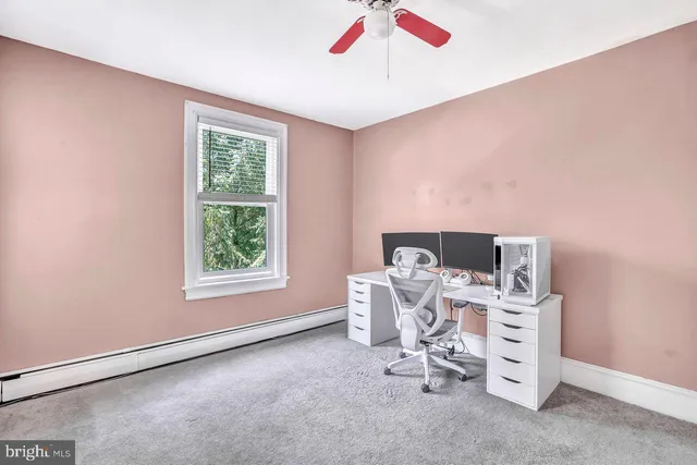 a balcony with furniture and wooden floor