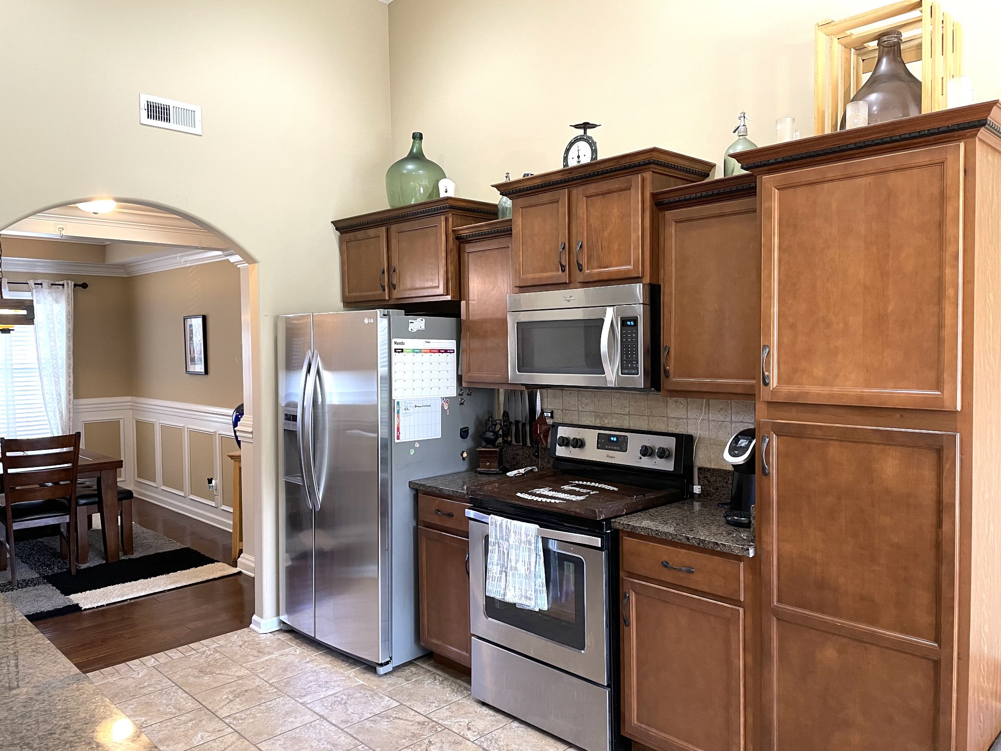 1458 Raven Road Clarksville, TN 37042 - Photo 11 of 33 a kitchen with stainless steel appliances granite countertop a refrigerator a stove and a sink with cabinets