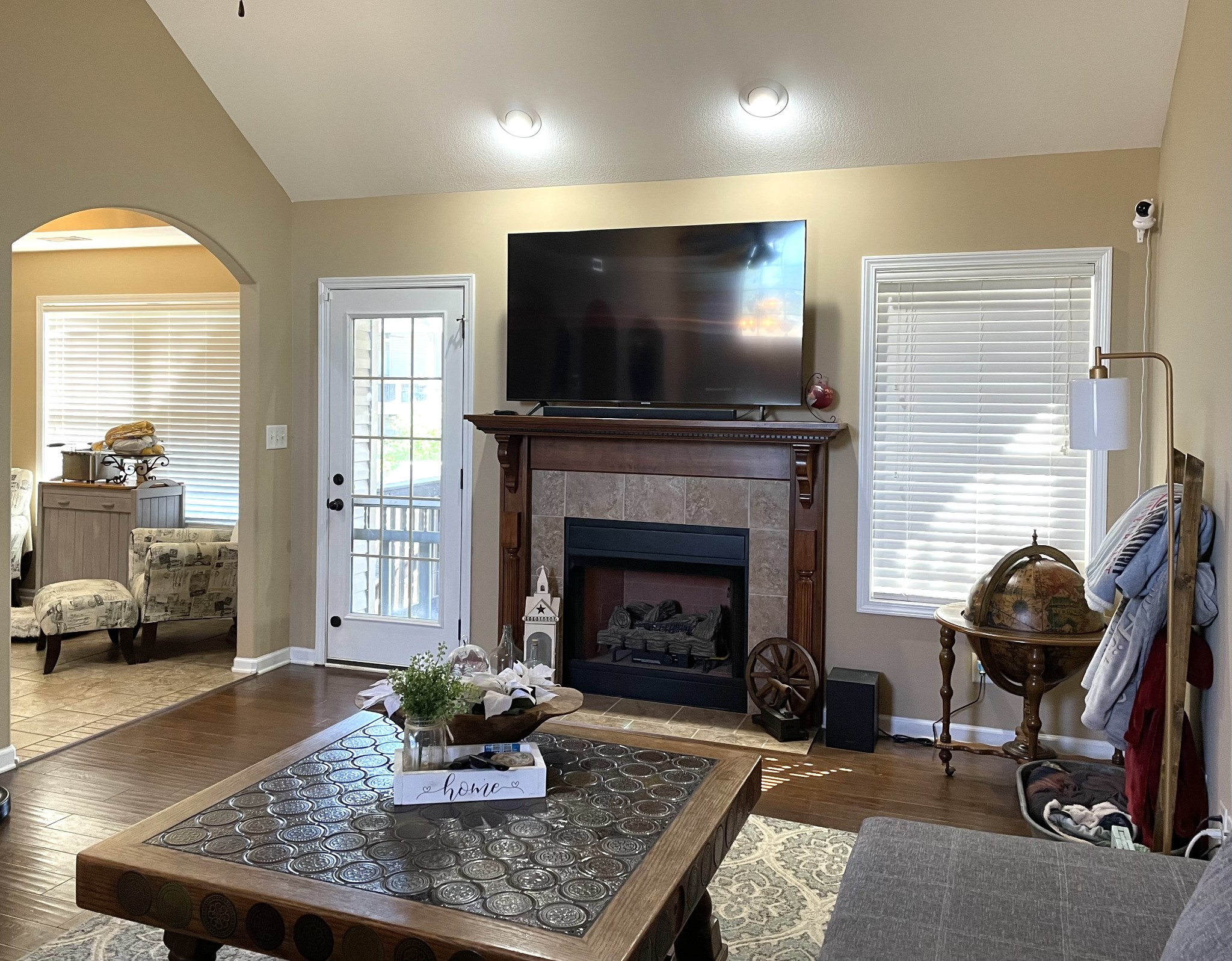 1458 Raven Road Clarksville, TN 37042 - Photo 5 of 33 a living room with furniture a flat screen tv and a fireplace