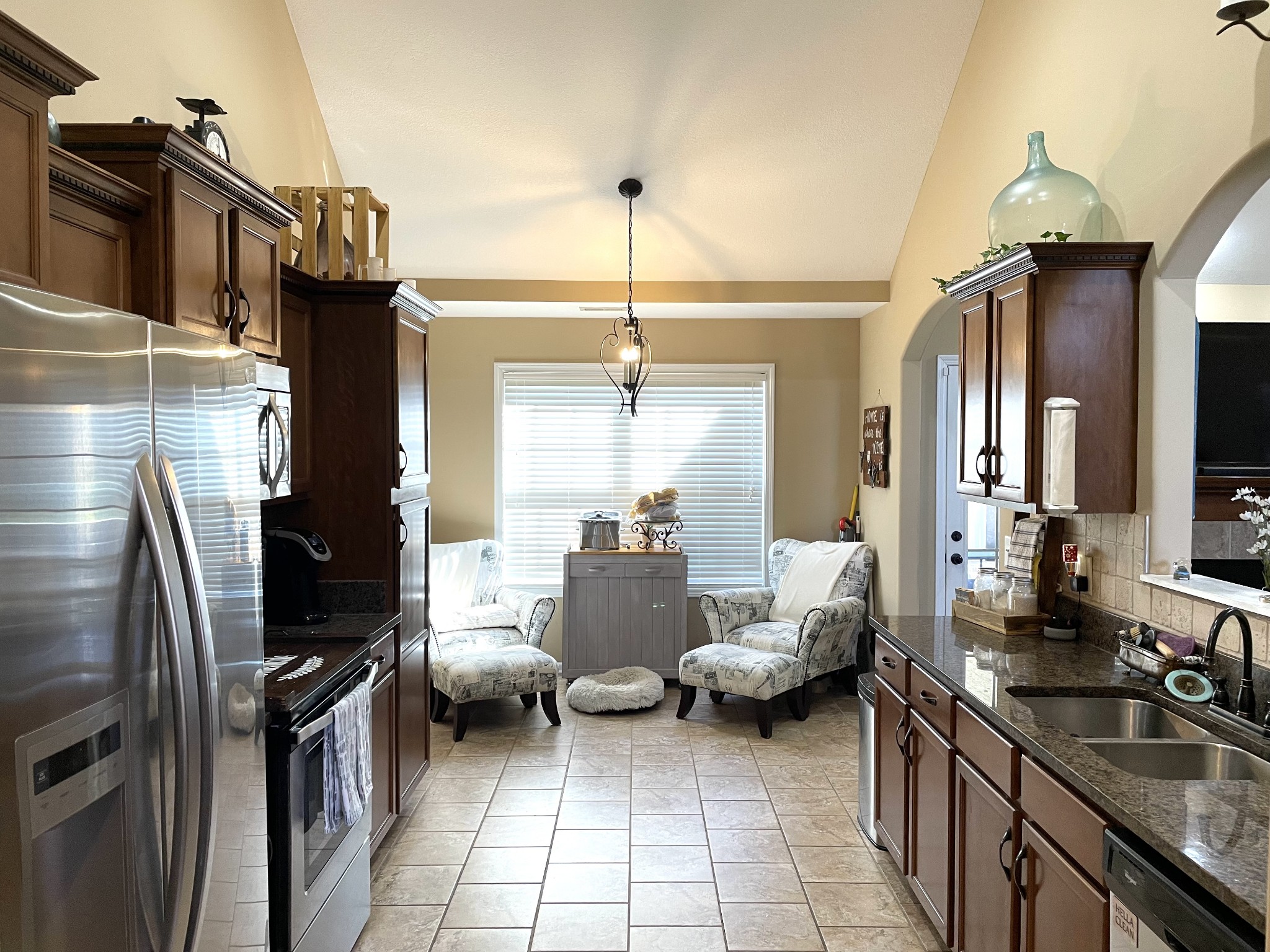 1458 Raven Road Clarksville, TN 37042 - Photo 9 of 33 a kitchen with a refrigerator and a sink