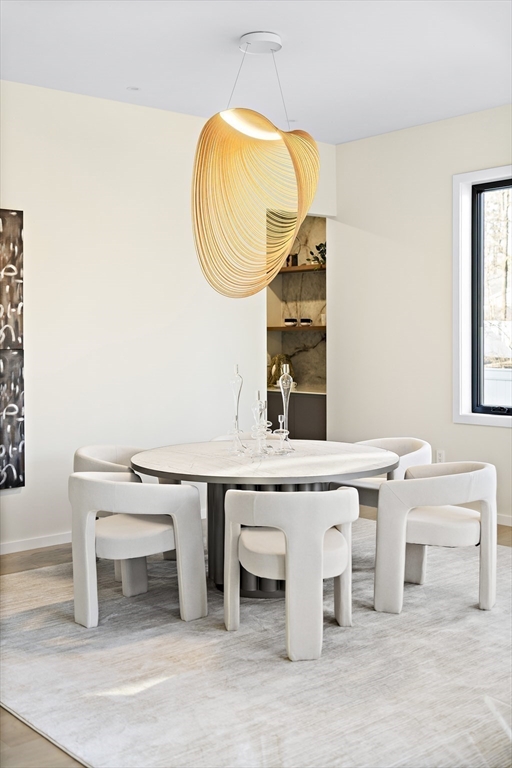 109 Wiswall Road Newton, MA 02459 - Photo 11 of 36 a room with a table and a chair