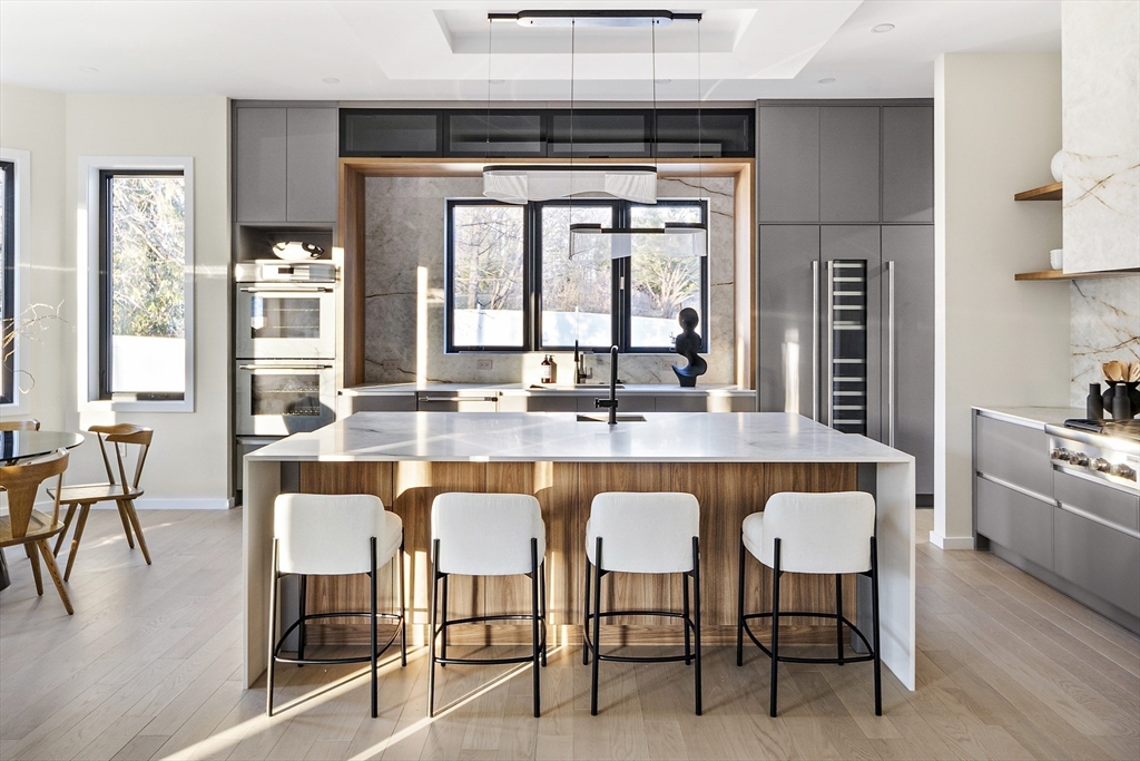 109 Wiswall Road Newton, MA 02459 - Photo 12 of 36 a dining table with chairs and window