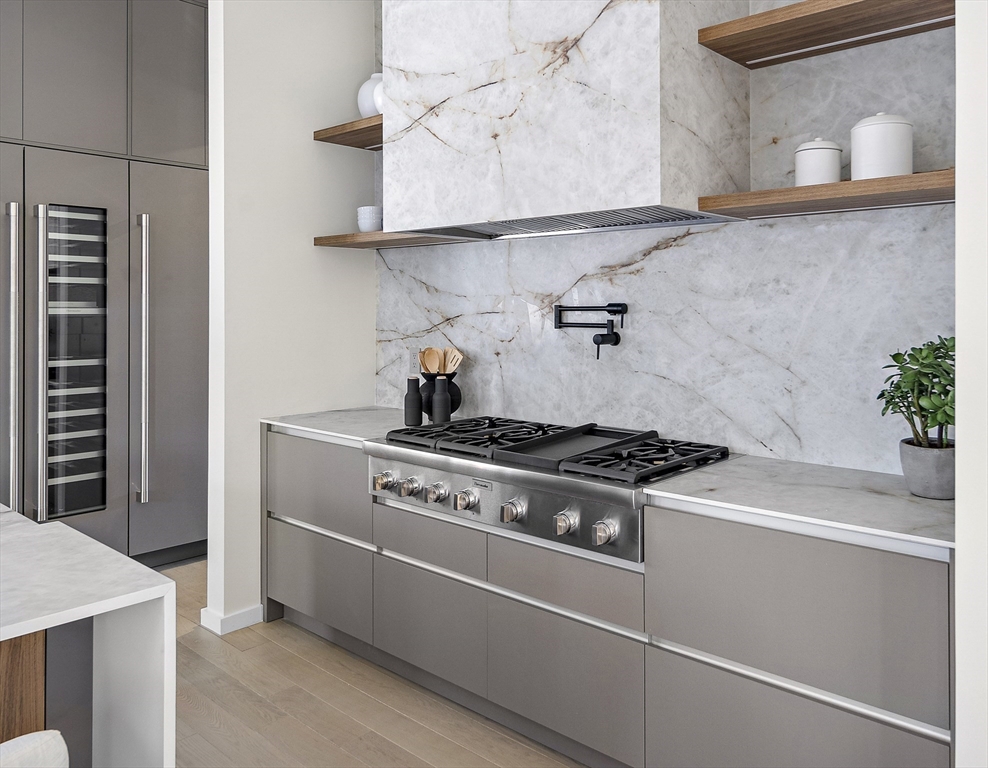109 Wiswall Road Newton, MA 02459 - Photo 15 of 36 a white stove top oven sitting inside of a kitchen