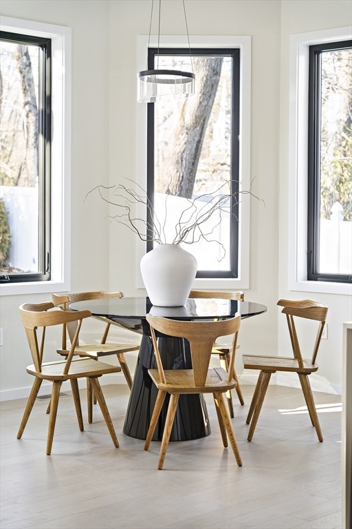 109 Wiswall Road Newton, MA 02459 - Photo 17 of 36 a view of a dining room with furniture and a window