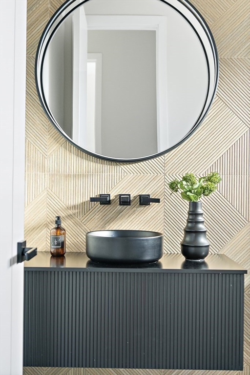 109 Wiswall Road Newton, MA 02459 - Photo 18 of 36 a bathroom with a sink and mirror