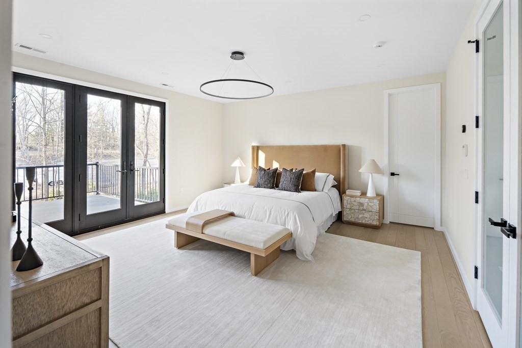 109 Wiswall Road Newton, MA 02459 - Photo 23 of 36 a bed room with a bed and a couch