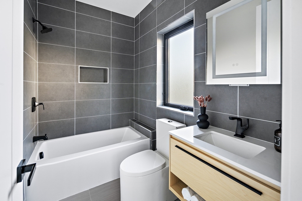 109 Wiswall Road Newton, MA 02459 - Photo 28 of 36 a bathroom with a sink and a bathtub