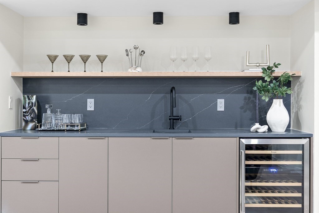 109 Wiswall Road Newton, MA 02459 - Photo 31 of 36 a sink with a potted plant on a counter and a potted plant on the counter