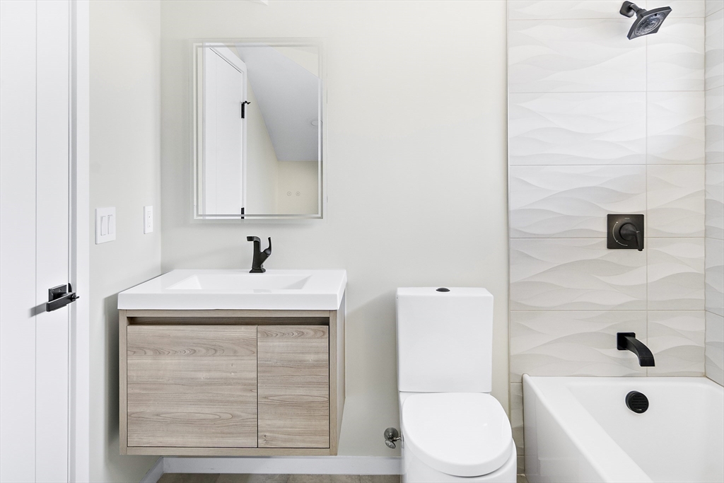 109 Wiswall Road Newton, MA 02459 - Photo 33 of 36 a bathroom with a sink a toilet and shower