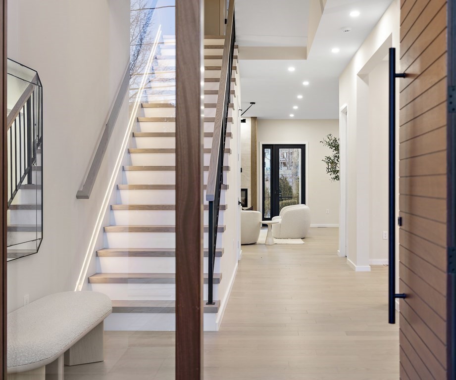 109 Wiswall Road Newton, MA 02459 - Photo 4 of 36 a view of a hallway with wooden floor and staircase