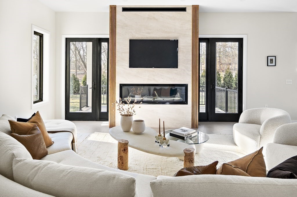 109 Wiswall Road Newton, MA 02459 - Photo 6 of 36 a living room with fireplace furniture and a flat screen tv
