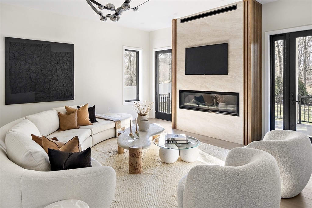 109 Wiswall Road Newton, MA 02459 - Photo 8 of 36 a living room with furniture and a flat screen tv