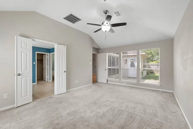 a view of an empty room with a window