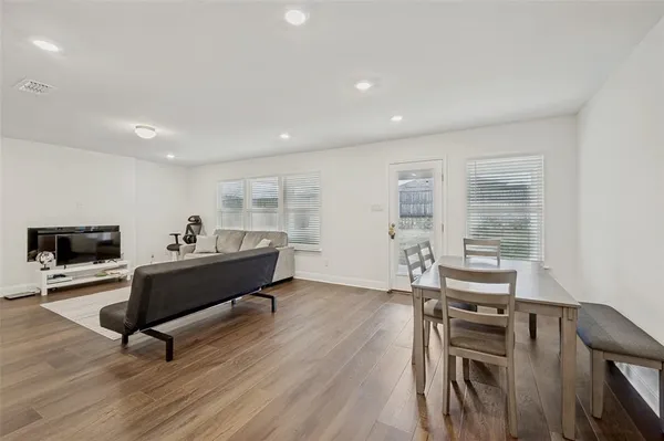 a kitchen with wooden cabinets and stainless steel appliances