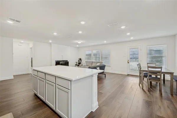 a kitchen with stainless steel appliances a sink stove and microwave