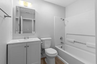 34 West 7th Street, Unit G Tracy, CA 95376 - Photo 5 of 7 a bathroom with a sink toilet and shower