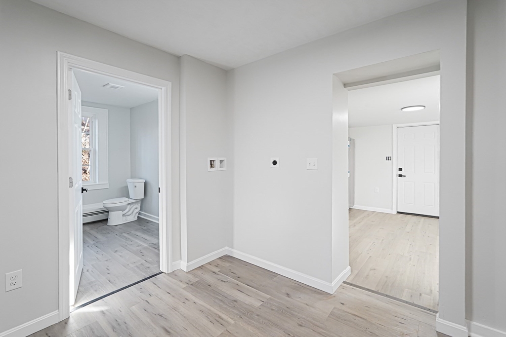 757 Main Street, Unit A Southbridge, MA 01550 - Photo 11 of 32 a view of room with wooden floor