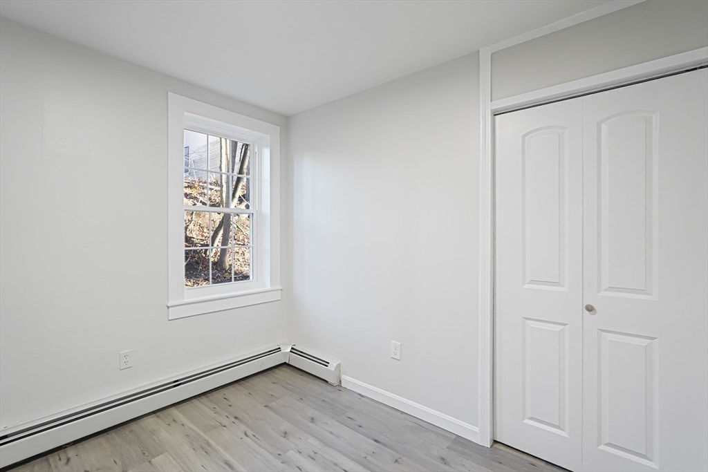 757 Main Street, Unit A Southbridge, MA 01550 - Photo 16 of 32 an empty room with windows