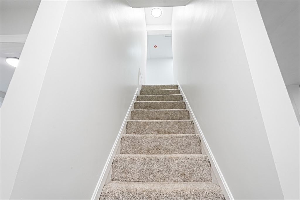 757 Main Street, Unit A Southbridge, MA 01550 - Photo 18 of 32 a view of staircase with white walls