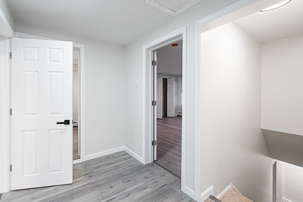 757 Main Street, Unit A Southbridge, MA 01550 - Photo 19 of 32 a view of a hallway with wooden floor
