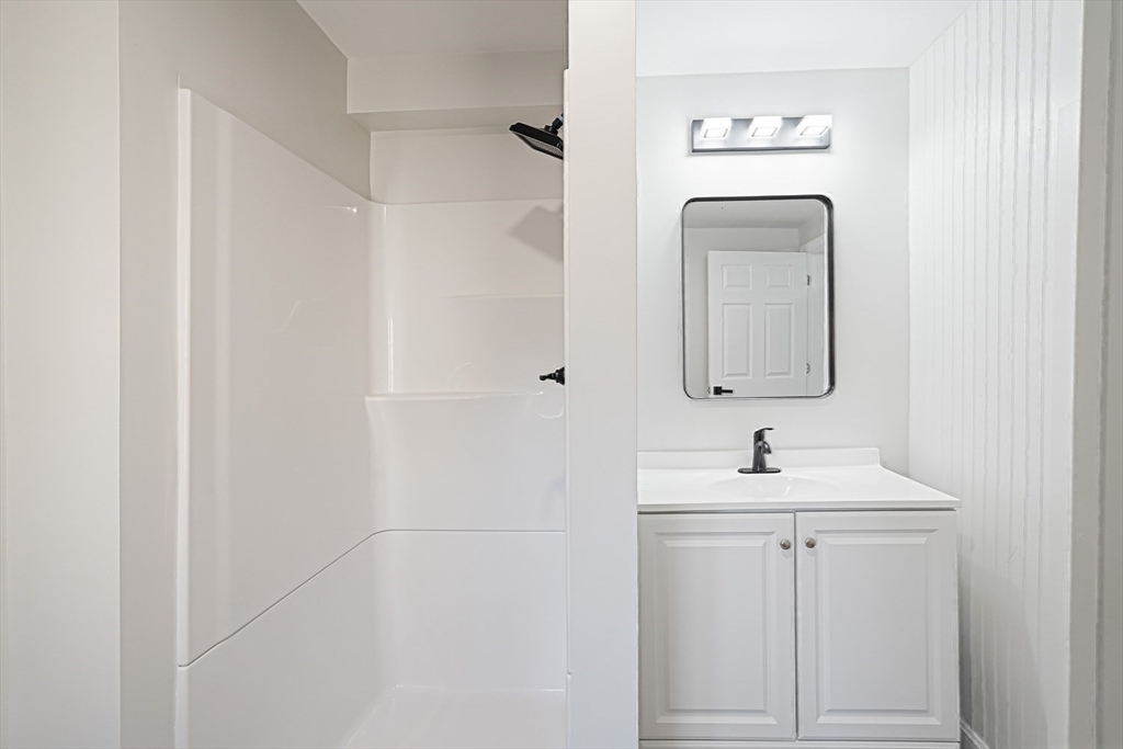 757 Main Street, Unit A Southbridge, MA 01550 - Photo 25 of 32 a bathroom with a sink and mirror