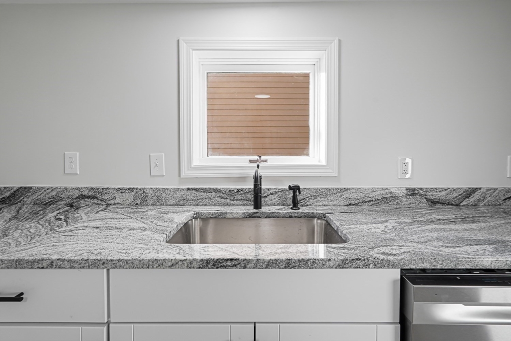 757 Main Street, Unit A Southbridge, MA 01550 - Photo 4 of 32 a kitchen with granite countertop a sink and a granite counter tops