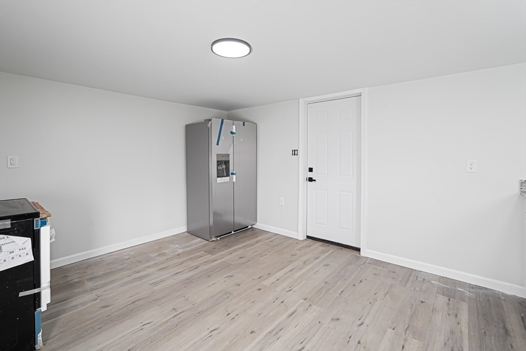 757 Main Street, Unit A Southbridge, MA 01550 - Photo 5 of 32 a view of an empty room with wooden floor