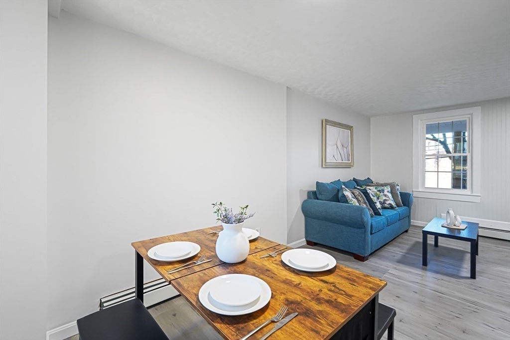 757 Main Street, Unit A Southbridge, MA 01550 - Photo 8 of 32 a view of a dining room with furniture and wooden floor